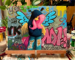 Size: 2048x1639 | Tagged: safe, artist:katputze, imported from derpibooru, fluttershy, anthro, pegasus, clothes, denim, female, graffiti, hand in pocket, hoodie, jeans, mare, pants, photo, ripped jeans, ripped pants, ripping clothes, solo, torn clothes, traditional art
