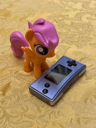 Size: 3024x4032 | Tagged: safe, imported from derpibooru, scootaloo, pegasus, pony, funko, game boy micro, irl, merchandise, photo, toy, video game