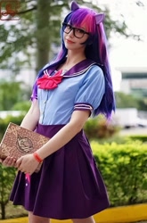 Size: 711x1080 | Tagged: safe, artist:flutterbutter cosplay, imported from derpibooru, twilight sparkle, human, book, book of harmony, clothes, cosplay, costume, glasses, irl, irl human, photo