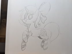 Size: 2048x1536 | Tagged: safe, artist:mellodillo, imported from derpibooru, oc, oc only, pony, unicorn, bow, clothes, female, grayscale, hair bow, looking at you, mare, monochrome, pencil drawing, smiling, socks, solo, striped socks, traditional art