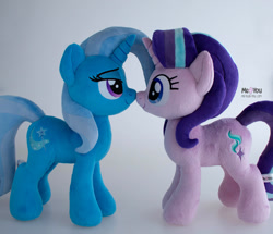 Size: 1500x1292 | Tagged: safe, artist:meplushyou, imported from derpibooru, starlight glimmer, trixie, pony, unicorn, boop, duo, female, gray background, irl, looking at each other, looking at someone, mare, noseboop, photo, plushie, simple background, smiling