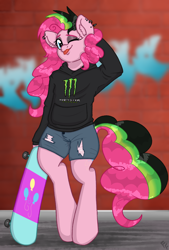 Size: 1846x2723 | Tagged: safe, artist:ponykittenboi, derpibooru exclusive, imported from derpibooru, pinkie pie, earth pony, semi-anthro, ;p, alternate hairstyle, arm behind head, bipedal, brick wall, clothes, denim, denim shorts, dyed mane, dyed tail, ear fluff, ear piercing, eyeshadow, graffiti, hoodie, logo, makeup, monster energy, one eye closed, piercing, punkie pie, shitposting, shorts, skateboard, solo, tail, tongue out, torn clothes, wink