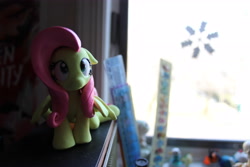 Size: 5184x3456 | Tagged: safe, artist:dustysculptures, imported from derpibooru, fluttershy, pegasus, pony, craft, female, frown, looking up, mare, sculpture, sitting, solo