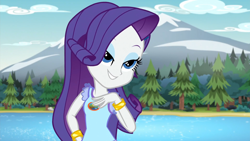 Size: 1920x1080 | Tagged: safe, imported from derpibooru, screencap, rarity, human, equestria girls, legend of everfree, 1080p, eyebrows, eyeshadow, female, grin, hand on hip, lidded eyes, makeup, mountain, river, smiling, solo, tree, water