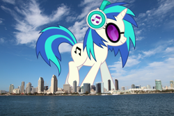 Size: 2100x1400 | Tagged: safe, artist:dashiesparkle, artist:jaredking779, imported from derpibooru, dj pon-3, vinyl scratch, pony, unicorn, california, female, giant pony, giant unicorn, giant vinyl scratch/giant dj-pon 3, giantess, glasses, headphones, highrise ponies, irl, macro, mare, mega giant, photo, ponies in real life, san diego