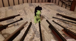 Size: 4032x2175 | Tagged: safe, oc, oc:filly anon, bed, female, filly, gun, irl, photo, plushie, rifle, shotgun, solo, weapon