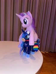 Size: 3024x4032 | Tagged: safe, artist:melodisde, artist:nekokevin, imported from derpibooru, photographer:sassysvczka, princess luna, starlight glimmer, alicorn, pony, unicorn, clothes, collar, cookie, female, flower, flower in hair, food, gala party, galacon, galacon 2022, irl, jewelry, mare, necklace, photo, plushie, ponies riding ponies, regalia, riding, riding a pony, socks, starlight glimmer riding princess luna