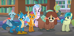 Size: 1502x738 | Tagged: safe, imported from derpibooru, screencap, gallus, ocellus, sandbar, silverstream, smolder, yona, changedling, changeling, classical hippogriff, dragon, earth pony, griffon, hippogriff, pony, yak, what lies beneath, bookshelf, bow, cloven hooves, cropped, dragoness, female, globe, hair bow, jewelry, monkey swings, necklace, offscreen character, student six