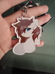 Size: 3120x4160 | Tagged: safe, artist:coarfdraw, imported from derpibooru, oc, oc only, oc:jet blast, pegasus, chest fluff, ear fluff, hoof fluff, irl, keychain, looking at you, photo, raised hoof, solo, worried