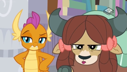 Size: 1249x703 | Tagged: safe, imported from derpibooru, screencap, smolder, yona, dragon, yak, the hearth's warming club, bow, cloven hooves, dragoness, duo, female, hair bow, hand on hip, monkey swings, raised eyebrow, smolder is not amused, unamused, yona is not amused