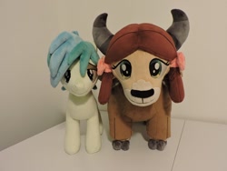 Size: 800x600 | Tagged: safe, artist:little-broy-peep, imported from derpibooru, sandbar, yona, earth pony, pony, yak, bow, cloven hooves, duo, female, hair bow, irl, male, monkey swings, photo, plushie, stallion