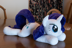 Size: 5184x3456 | Tagged: safe, artist:azgchip, imported from derpibooru, rarity, pony, unicorn, female, irl, lying down, mare, photo, plushie, prone, solo, table