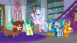 Size: 1600x898 | Tagged: safe, imported from derpibooru, screencap, gallus, ocellus, sandbar, silverstream, smolder, yona, changedling, changeling, classical hippogriff, dragon, earth pony, griffon, hippogriff, pony, yak, school raze, book, bookshelf, bow, cloven hooves, colored hooves, dragoness, female, hair bow, jewelry, ladder, male, monkey swings, necklace, school of friendship, spread wings, student six, wings