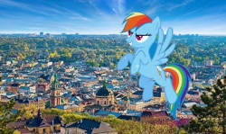 Size: 845x503 | Tagged: safe, imported from derpibooru, screencap, rainbow dash, pegasus, pony, the ticket master, female, flying, giant pony, irl, lviv, macro, mare, photo, ponies in real life, solo, spread wings, ukraine, wings