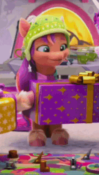 Size: 370x652 | Tagged: safe, imported from derpibooru, screencap, sunny starscout, earth pony, pony, spoiler:g5, spoiler:winter wishday, animated, board game, cropped, cute, female, fireplace, g5, gif, hat, mare, mouth hold, my little pony: make your mark, my little pony: make your mark chapter 3, open mouth, present, sitting, sunnybetes, winter wishday