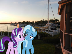 Size: 2048x1536 | Tagged: safe, artist:charity-rose, artist:jaredking779, imported from derpibooru, starlight glimmer, trixie, pony, unicorn, bedroom eyes, boat, duo, female, florida, fort myers, irl, lidded eyes, mare, photo, ponies in real life, raised hoof, river, ship, smiling, water