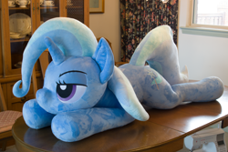 Size: 5184x3456 | Tagged: safe, artist:azgchip, imported from derpibooru, trixie, pony, unicorn, bedroom eyes, female, irl, life size, lying down, mare, photo, plushie, prone, solo, sploot, table