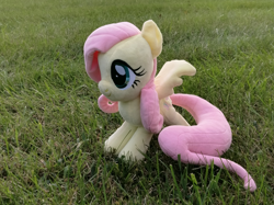 Size: 3671x2753 | Tagged: safe, artist:natsnaps, imported from derpibooru, fluttershy, pegasus, grass, grass field, irl, outdoors, photo, plushie, solo