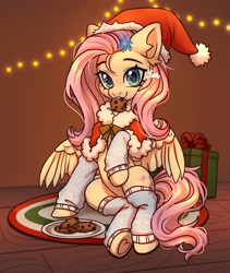 Size: 3459x4096 | Tagged: safe, artist:konejo, imported from derpibooru, fluttershy, pony, christmas, clothes, commission, cookie, cute, daaaaaaaaaaaw, ear fluff, eyebrows, female, food, g4, hat, high res, holiday, leg warmers, looking at you, mare, mouth hold, present, santa hat, shyabetes, sitting, smiling, smiling at you, solo, wings