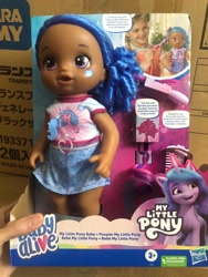 Size: 1500x2000 | Tagged: safe, imported from derpibooru, izzy moonbow, human, pony, unicorn, baby, baby alive, comments locked down, dark skin, doll, duckery in the comments, g5, irl, merchandise, official, photo, target demographic, toy