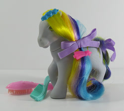 Size: 674x600 | Tagged: safe, imported from derpibooru, earth pony, pony, barrette, bow, brush, brush 'n grow ponies, comb, female, g1, hair bow, irl, mane, mare, photo, raised hoof, ringlets (g1), smiling, tail, tail bow, toy