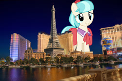 Size: 2249x1500 | Tagged: safe, artist:thatguy1945, artist:theotterpony, imported from derpibooru, coco pommel, earth pony, pony, bag, female, giant pony, giantess, highrise ponies, irl, las vegas, macro, mare, necktie, nevada, photo, ponies in real life, saddle bag, smiling, solo