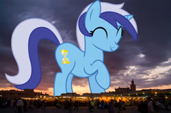 Size: 1000x665 | Tagged: safe, artist:birthofthepheonix, edit, editor:jaredking779, imported from derpibooru, minuette, pony, unicorn, background pony, cute, female, giant pony, giant unicorn, giantess, highrise ponies, irl, macro, mare, marrakech, marrakesh, mega giant, mega/giant minuette, minubetes, photo, ponies in real life, raised hoof, solo