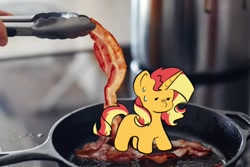Size: 730x487 | Tagged: safe, artist:indigohatetrain, edit, imported from derpibooru, sunset shimmer, pony, unicorn, bacon, female, food, frying pan, irl, meat, photo, solo, sweat