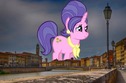 Size: 2047x1356 | Tagged: safe, artist:thebosscamacho, edit, editor:jaredking779, imported from derpibooru, cookie crumbles, pony, unicorn, clothes, ear piercing, female, giant pony, giant unicorn, giantess, highrise ponies, irl, italy, jewelry, macro, mare, mega giant, photo, piercing, pisa, ponies in real life, scarf, smiling, solo