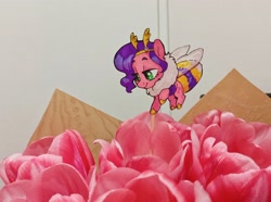 Size: 2936x2185 | Tagged: safe, artist:jewellier, imported from derpibooru, photographer:jewellier, pipp petals, bee, bee pony, hybrid, original species, pony, antennae, bouquet, bumblebee, bumblebipp, chest fluff, chibi, featured image, female, flower, g5, insect wings, irl, paper child, photo, pipp is short, pipp is smol, ponies in real life, smol, solo, species swap, this will end in pollination, tiny, tiny ponies, traditional art, tulip, wings