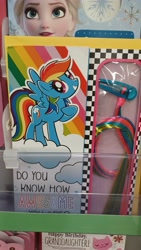 Size: 4000x2250 | Tagged: safe, imported from derpibooru, rainbow dash, pegasus, pony, birthday card, female, irl, looking at you, photo, raised hoof, solo, spread wings, walmart, wings