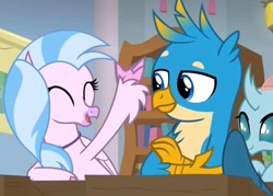 Size: 2160x1550 | Tagged: safe, imported from derpibooru, screencap, gallus, ocellus, silverstream, changeling, griffon, hippogriff, a rockhoof and a hard place, bookshelf, classroom, cute, desk, excited, eyes closed, female, happy, male, school