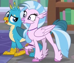 Size: 1855x1580 | Tagged: safe, imported from derpibooru, screencap, gallus, silverstream, griffon, hippogriff, a matter of principals, bookshelf, cropped, duo, duo male and female, excited, female, happy, male, rug, school, smug