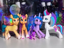 Size: 3432x2574 | Tagged: safe, imported from derpibooru, hitch trailblazer, izzy moonbow, pipp petals, sunny starscout, zipp storm, earth pony, pegasus, pony, unicorn, colored wings, concave belly, g5, height difference, irl, mane five (g5), mini world magic, multicolored hair, multicolored wings, photo, physique difference, pipp is short, pipp is smol, rainbow hair, slim, smol, thin, tiny, toy, unshorn fetlocks, wings