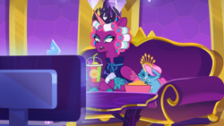 Size: 1280x720 | Tagged: safe, imported from derpibooru, screencap, opaline arcana, alicorn, pony, raccoon, spoiler:g5, spoiler:my little pony: tell your tale, spoiler:tyts01e50, bowl, couch, crown, duo, eating, female, food, frown, g5, hair curlers, hoof polish, jewelry, mare, my little pony: tell your tale, opaline alone, open mouth, popcorn, puffy cheeks, raccoonicorn, regalia, sitting, smoothie, television, watching tv, wig