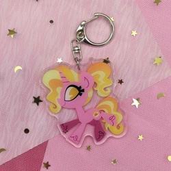 Size: 2048x2049 | Tagged: safe, artist:spacekitsch, imported from derpibooru, luster dawn, pony, unicorn, cute, female, irl, keychain, lusterbetes, mare, merchandise, photo, selling, solo, sparkles, unshorn fetlocks