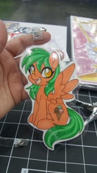 Size: 1152x2048 | Tagged: safe, artist:inkkeystudios, imported from derpibooru, oc, oc only, pegasus, pony, badge, eye clipping through hair, open mouth, open smile, photo, smiling, solo, spread wings, traditional art, wings