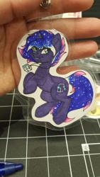 Size: 1152x2048 | Tagged: safe, artist:inkkeystudios, imported from derpibooru, oc, oc only, pony, unicorn, badge, ethereal mane, eye clipping through hair, galaxy mane, jewelry, looking at you, necklace, pendant, photo, smiling, solo, traditional art