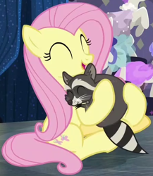 Size: 446x514 | Tagged: safe, imported from derpibooru, screencap, fluttershy, softpad, pegasus, pony, raccoon, fake it 'til you make it, season 8, spoiler:s08, cropped, cute, eyes closed, female, happy, hnnng, hug, mare, shyabetes