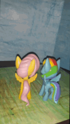 Size: 612x1088 | Tagged: safe, artist:dex stewart, imported from derpibooru, fluttershy, rainbow dash, pegasus, pony, animated, dvd, roger & me, sound, stop motion, text, webm