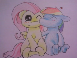 Size: 640x480 | Tagged: safe, artist:fluttersdoodles, imported from derpibooru, fluttershy, rainbow dash, blushing, cheek kiss, eyes closed, female, flutterdash, folded wings, kissing, lesbian, one eye closed, open mouth, shipping, sitting, surprised, traditional art, wings, wink