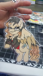 Size: 5312x2988 | Tagged: safe, artist:inkkeystudios, imported from derpibooru, oc, oc only, pegasus, pony, badge, clothes, colored wings, colored wingtips, glasses, jacket, jewelry, lidded eyes, looking at you, necklace, photo, solo, traditional art, two toned wings, unamused, wings