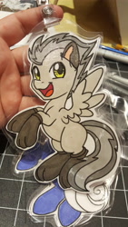 Size: 5312x2988 | Tagged: safe, artist:inkkeystudios, imported from derpibooru, oc, oc only, pegasus, pony, badge, clothes, looking at you, open mouth, open smile, paw socks, photo, smiling, socks, solo, spread wings, traditional art, wings