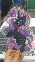 Size: 5312x2988 | Tagged: safe, artist:inkkeystudios, imported from derpibooru, nightmare rarity, pony, unicorn, badge, eye clipping through hair, lidded eyes, looking at you, open mouth, open smile, photo, smiling, solo, traditional art