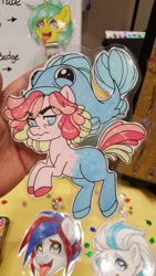 Size: 5312x2988 | Tagged: safe, artist:inkkeystudios, imported from derpibooru, oc, oc only, earth pony, fish, pony, ahegao, badge, frown, looking at you, open mouth, photo, smiling, solo focus, tongue out, traditional art, unamused