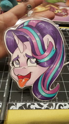 Size: 5312x2988 | Tagged: safe, artist:inkkeystudios, imported from derpibooru, starlight glimmer, human, pony, unicorn, ahegao, badge, bust, eye clipping through hair, eyes rolling back, heart, heart eyes, irl, irl human, open mouth, open smile, photo, portrait, smiling, solo, tongue out, traditional art, wingding eyes