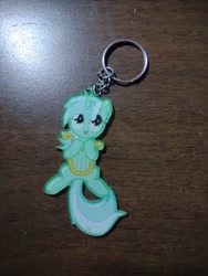 Size: 972x1296 | Tagged: safe, imported from derpibooru, lyra heartstrings, pony, unicorn, female, horn, irl, keychain, lyre, mare, merchandise, musical instrument, photo, solo