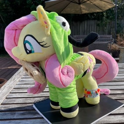 Size: 2048x2036 | Tagged: safe, artist:orky, imported from derpibooru, fluttershy, pegasus, pony, antonymph, clothes, ear piercing, earring, female, fluttgirshy, folded wings, food, gir, happy, hood up, hoodie, invader zim, irl, jewelry, mare, photo, piercing, plushie, solo, standing, vylet pony, waffle, wings