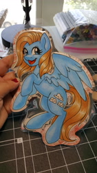 Size: 5312x2988 | Tagged: safe, artist:inkkeystudios, imported from derpibooru, oc, oc only, pegasus, pony, badge, happy, looking at you, open mouth, open smile, photo, smiling, solo, spread wings, traditional art, wings
