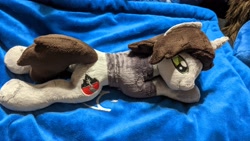 Size: 3840x2160 | Tagged: safe, artist:valmiiki, imported from derpibooru, photographer:lightningbolt, pony, unicorn, clothes, commission, horn, irl, kellin quinn, lying down, male, photo, plushie, ponified, prone, shirt, sleeping with sirens, smiling, solo, stallion, t-shirt